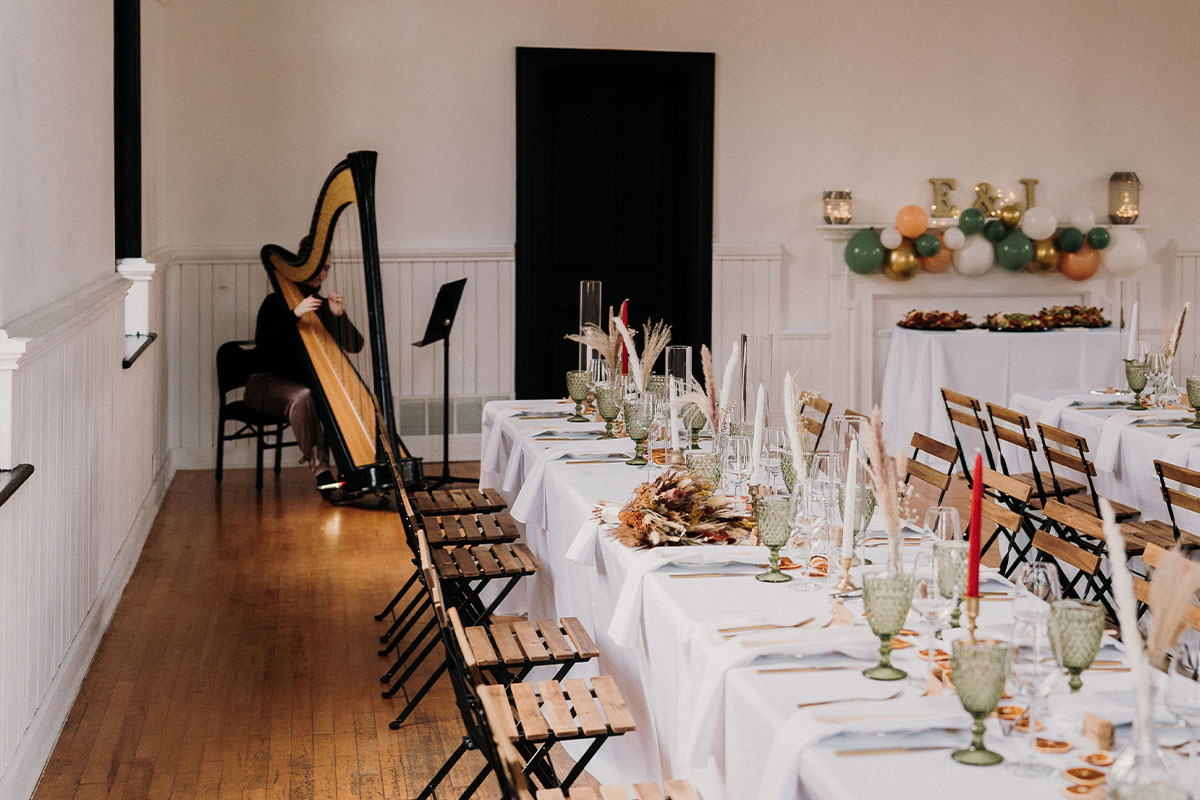 Hannah Warren Harpist - Blog Post - How much does it cost to hire a wedding harpist - Photo of Hannah playing a wedding at The Knox by Lauren McCormick Photography